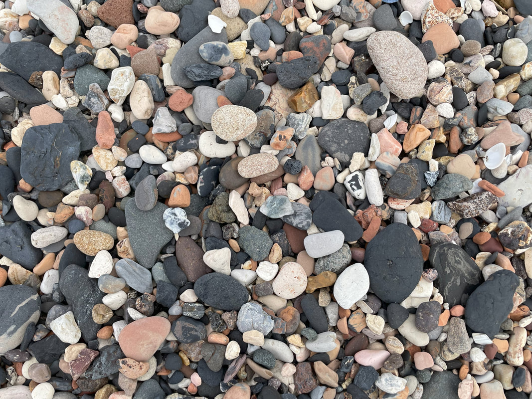 Pebbles on the beach at Pathhead Sands, Kirkcaldy. They are different colours, shapes, sizes and textures
