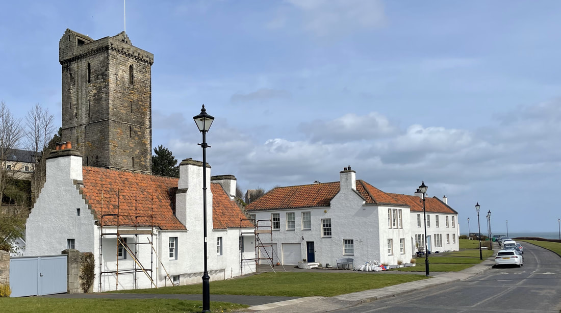 Pan Ha' in Dysart. A row of white houses with St Serf's tower behind them